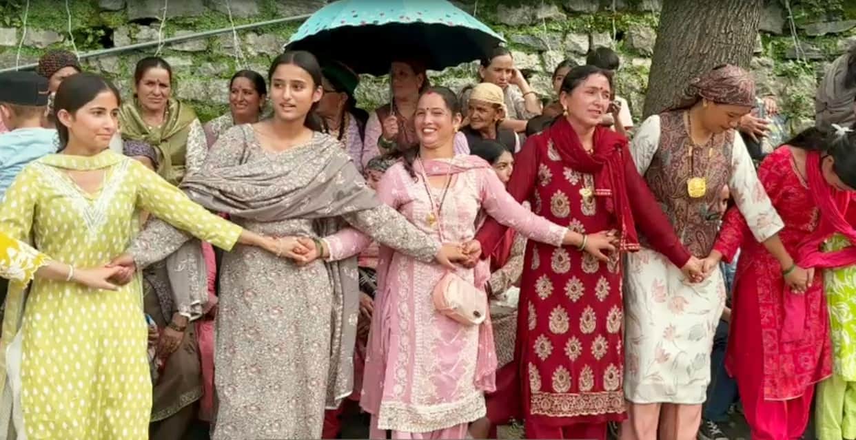 People danced to the tunes of musical instruments at the Sawan fair in Racholi