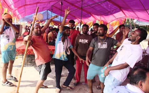Bholenath is arriving from Haridwar, seated in a palanquin.