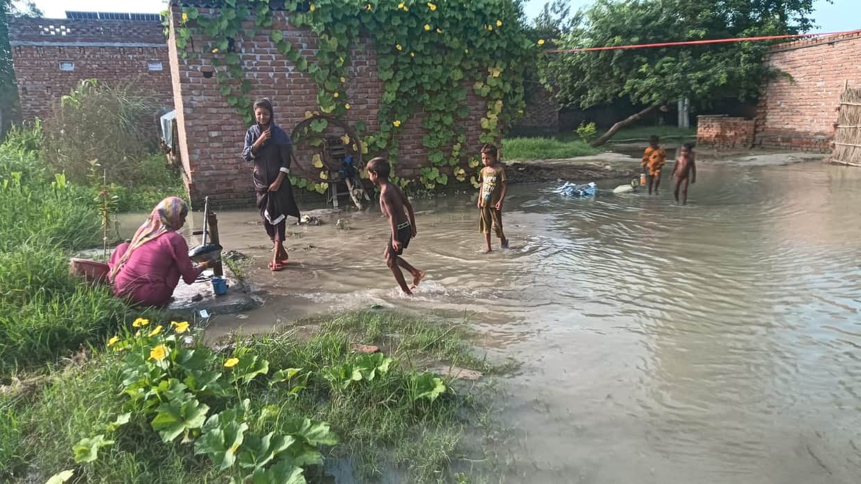 Floodwaters reach homes; risk of disease spread due to waterlogging.