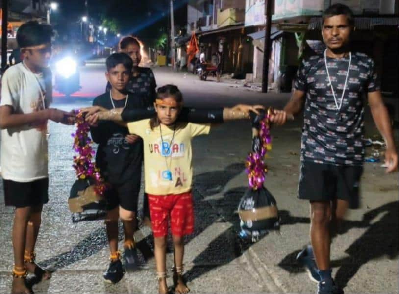 People moved with emotion upon seeing a little girl carrying a Kanwar.
