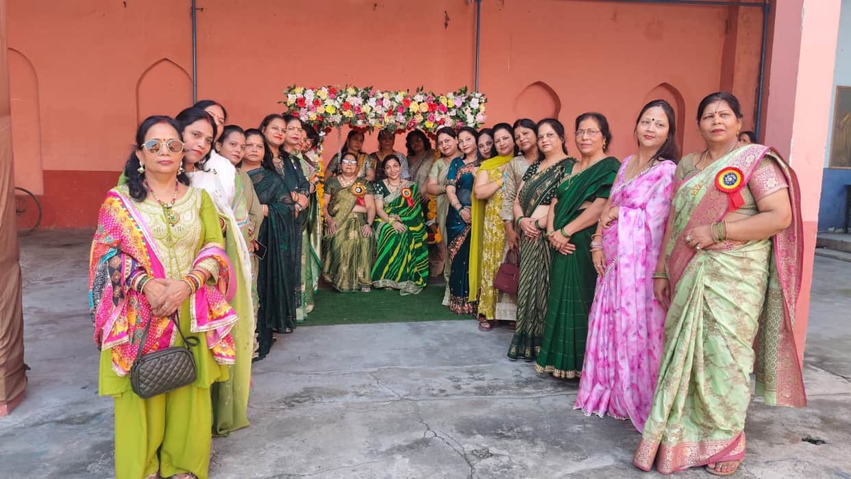 Women adorned in the traditional 'Solah Shringar' (sixteen adornments) for the Teej festival.