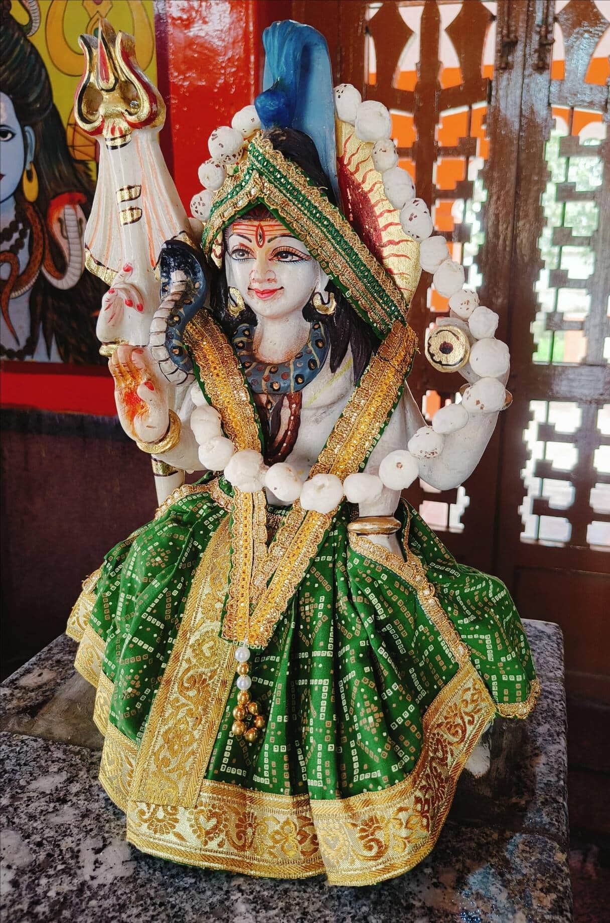 Heereshwarnath Mahadev adorned with a divine green-themed decoration.