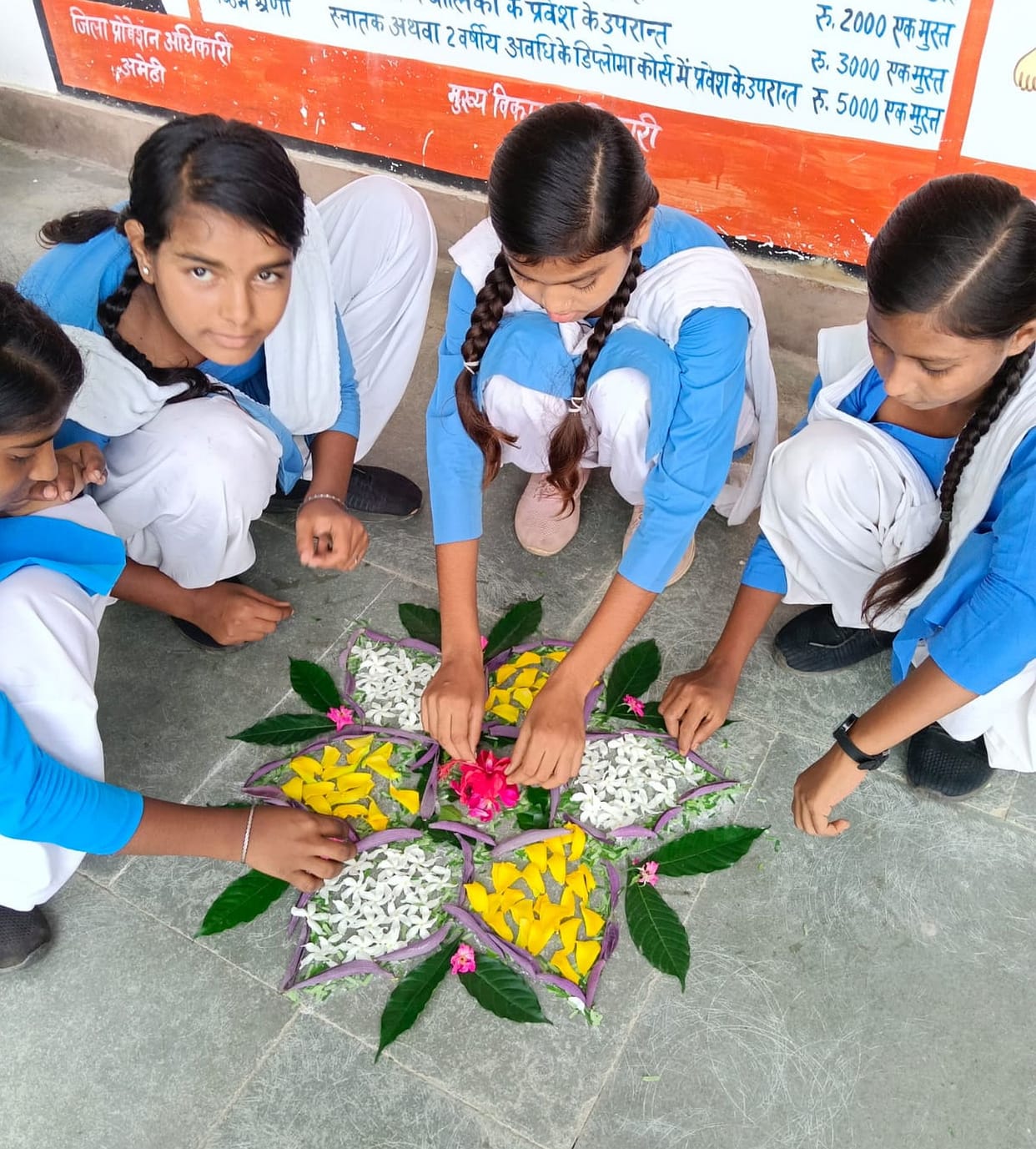 Kshama and Divya excel in Rangoli.