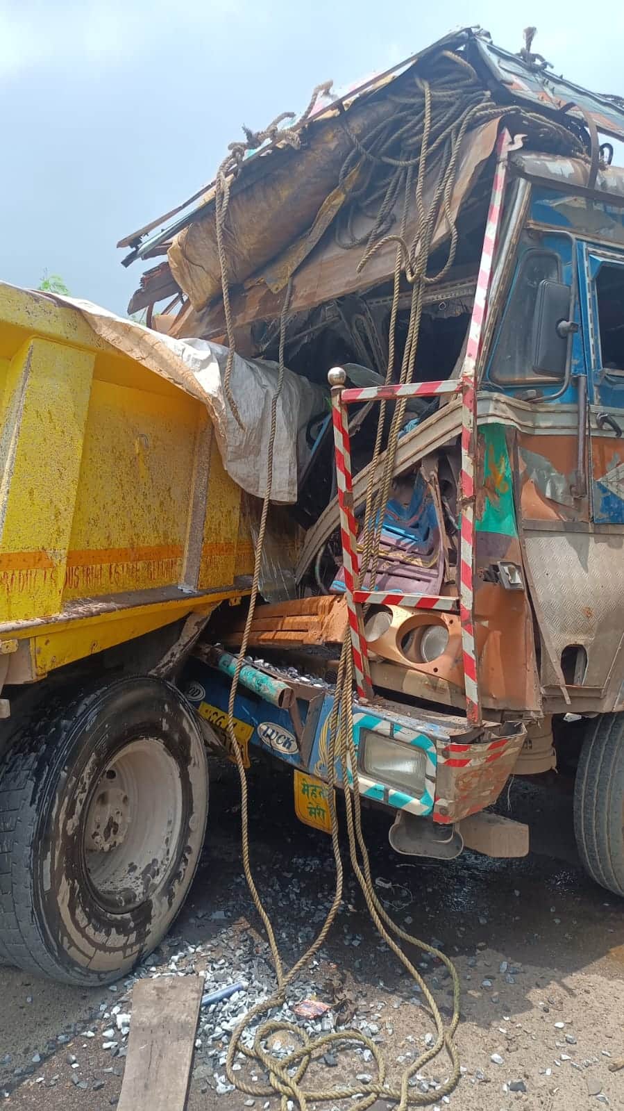 Collision between tipper and truck; truck driver dies.