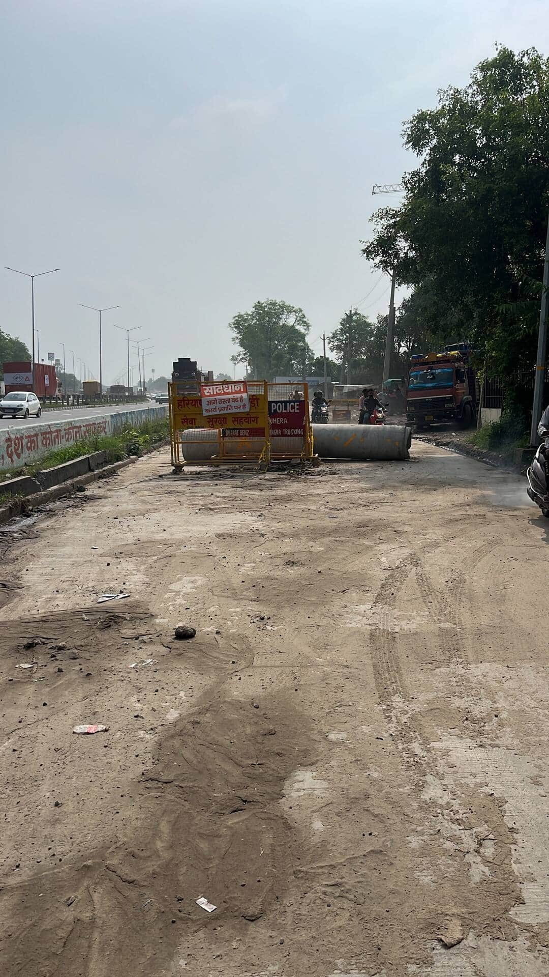 Completed service road blocked with barricades; inconvenience mounts for Kanwariyas and the general public.