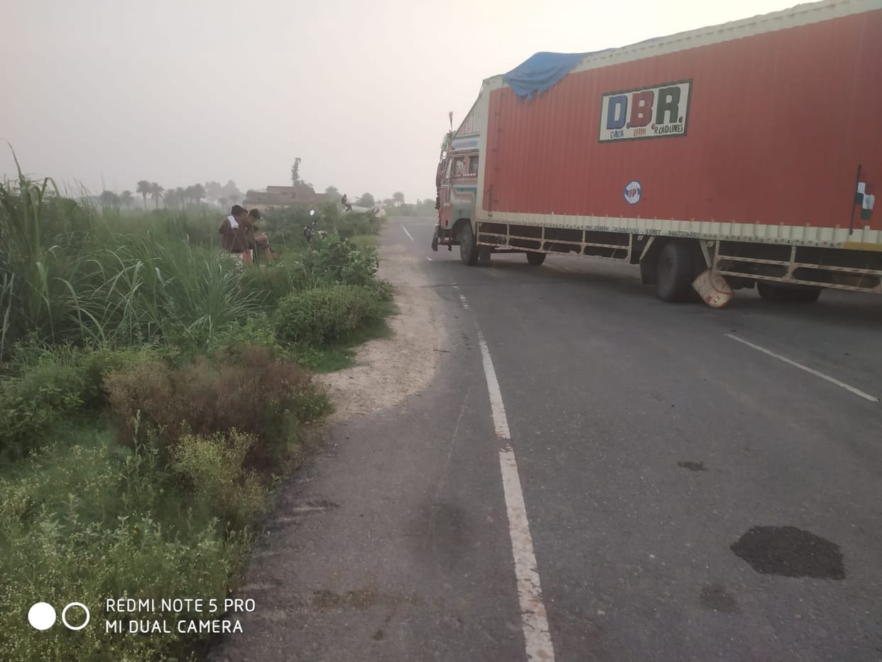 Container mounts divider near a sharp curve.