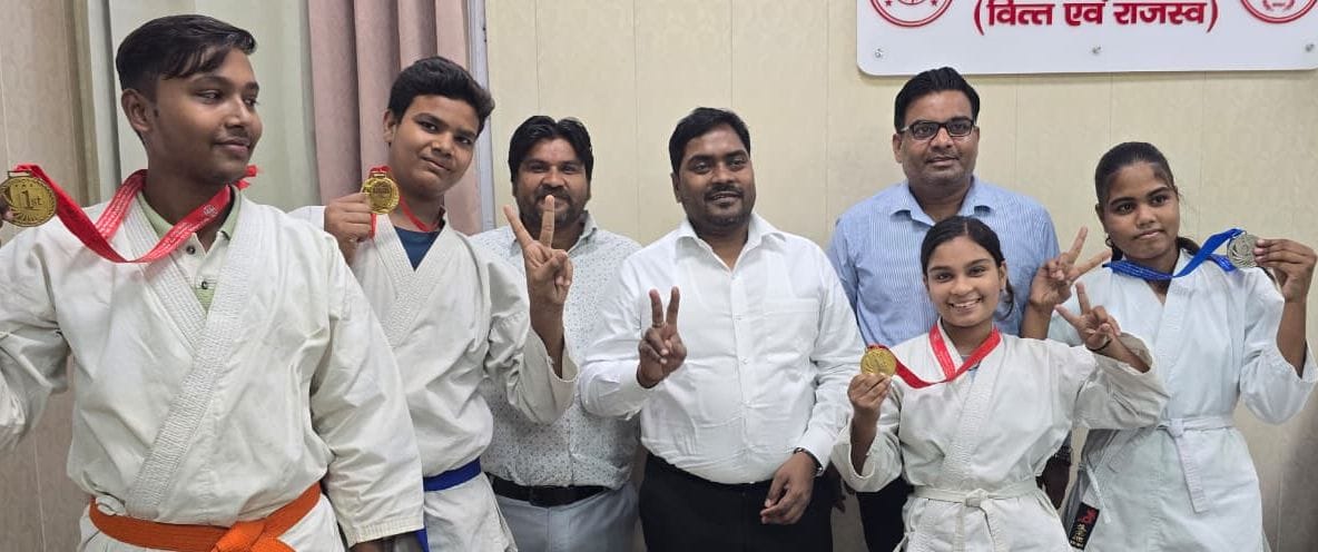 Four karate medalists felicitated.