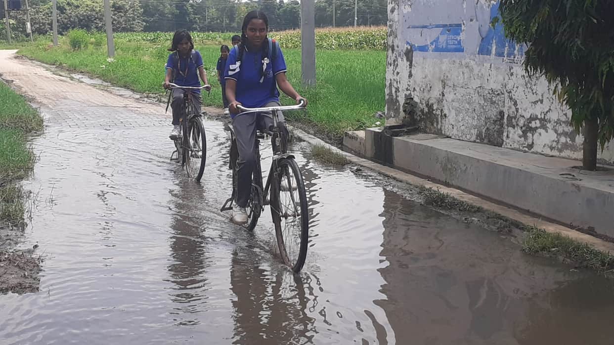 Drains choked in Rampur; pedestrians forced to wade through dirty water.
