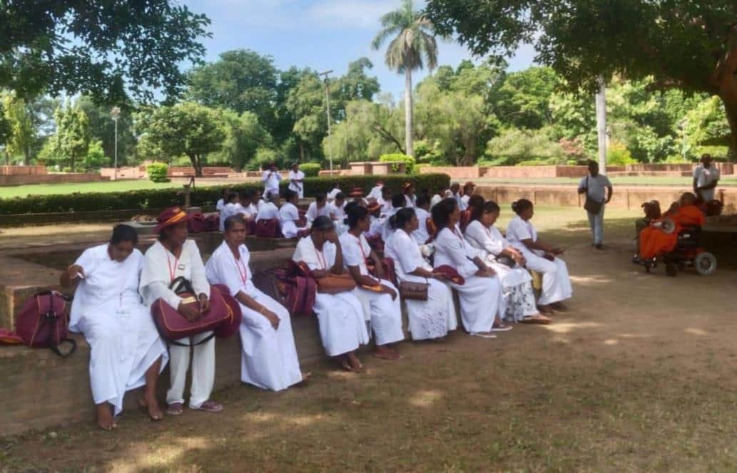 Followers from Sri Lanka arrive at the Buddhist pilgrimage site.