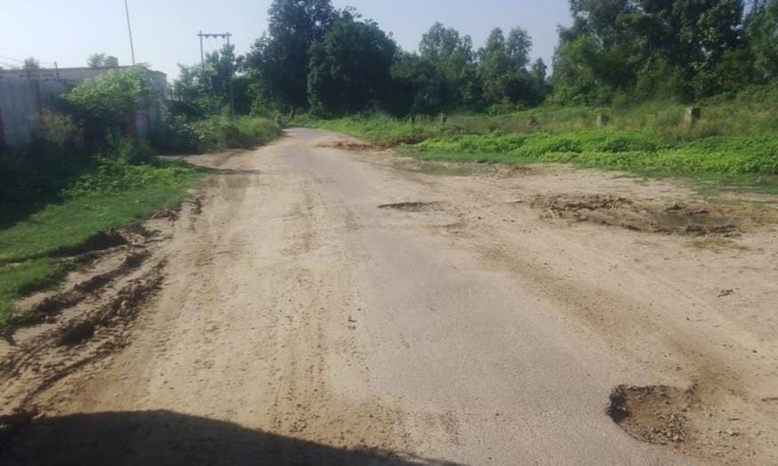 Rural roads riddled with potholes; travel has become a nightmare for commuters.