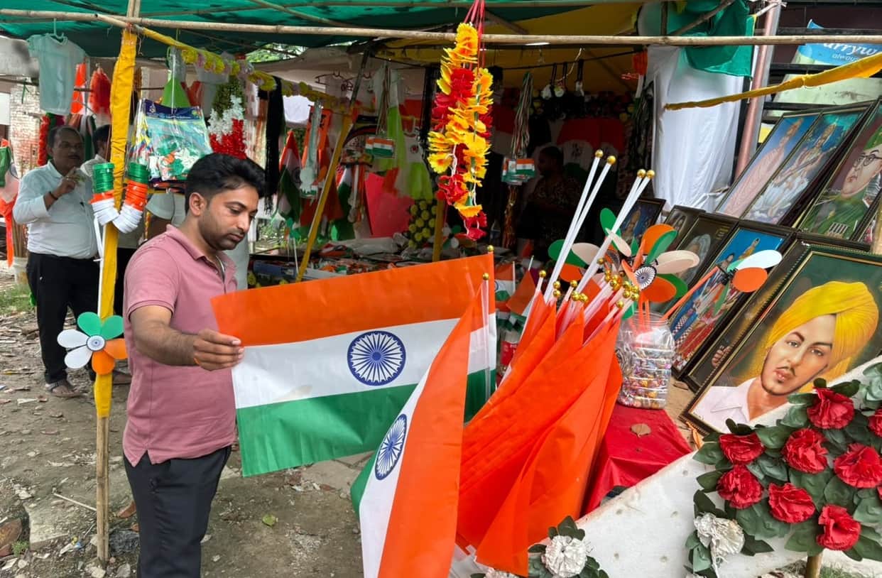 Markets abuzz with tricolour flags and stickers.
