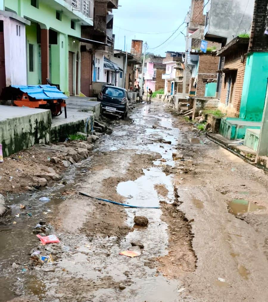 The road repaired a month ago was washed away in the rain