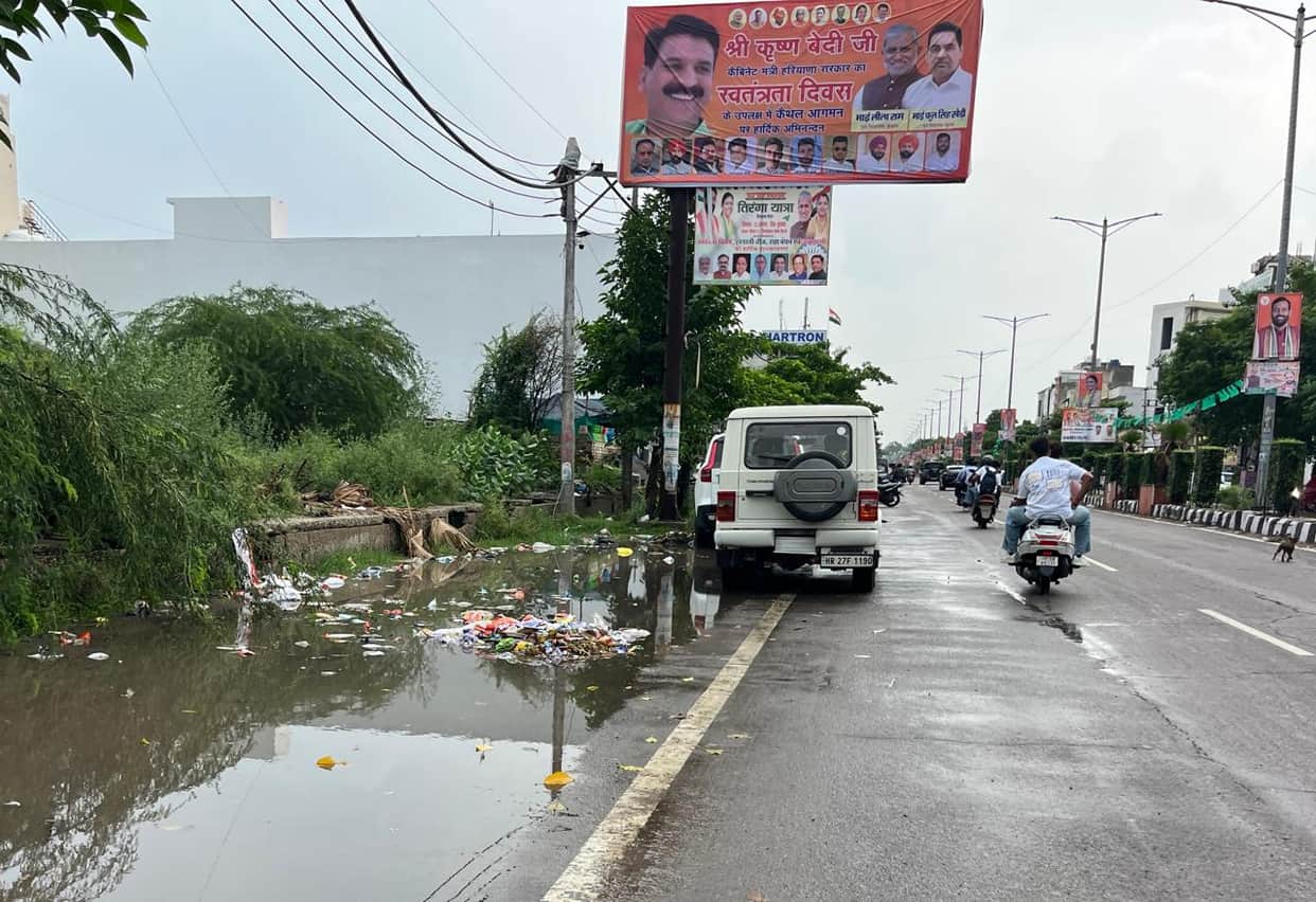 City illuminated for Independence Day; piles of garbage on the streets.