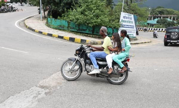Tourists flouting traffic rules.