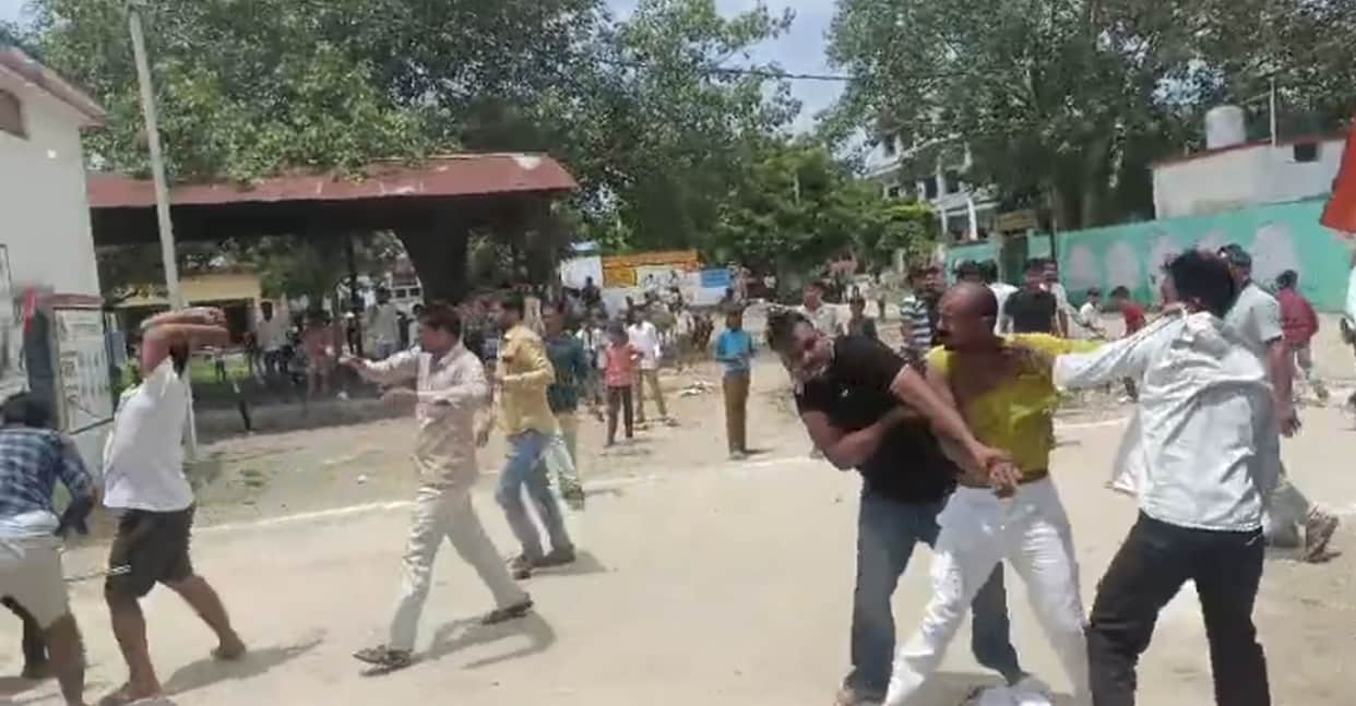 Two groups clashed over a dispute involving children; six people, including the village head, were injured.
