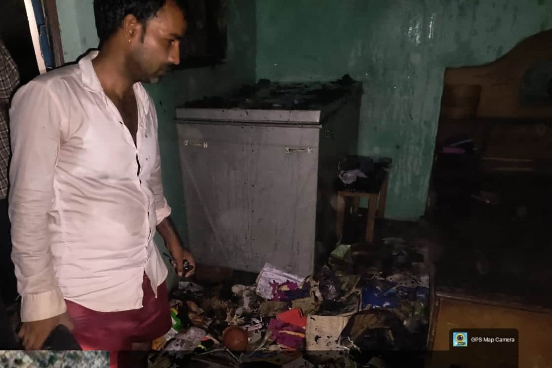Fire caused by gas cylinder burns household belongings; couple suffers burns while trying to extinguish it.