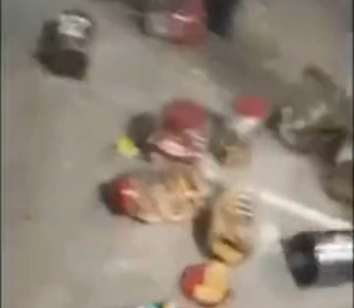 Vandalism at shop following a dispute; goods thrown onto the street.