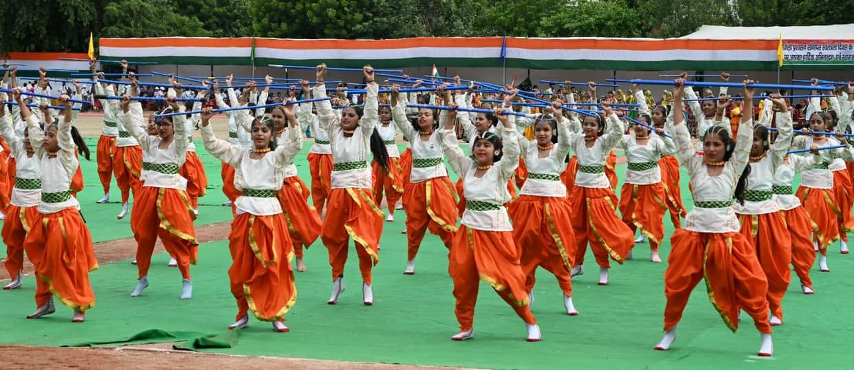 Message of patriotism echoes across the district on Independence Day; Industries Minister hoists the flag.