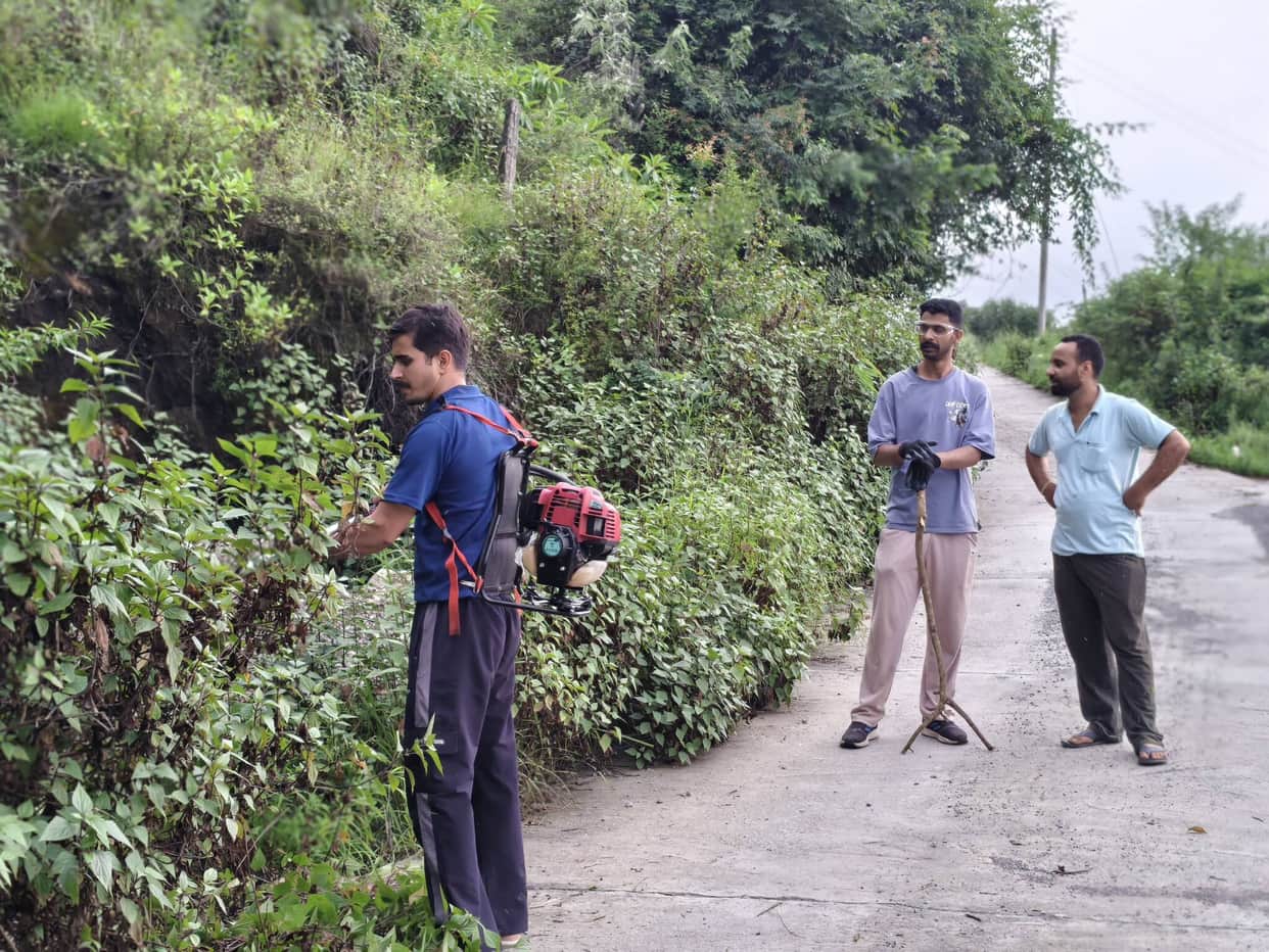 Youths spruced up the ambulance route leading to Baga village.