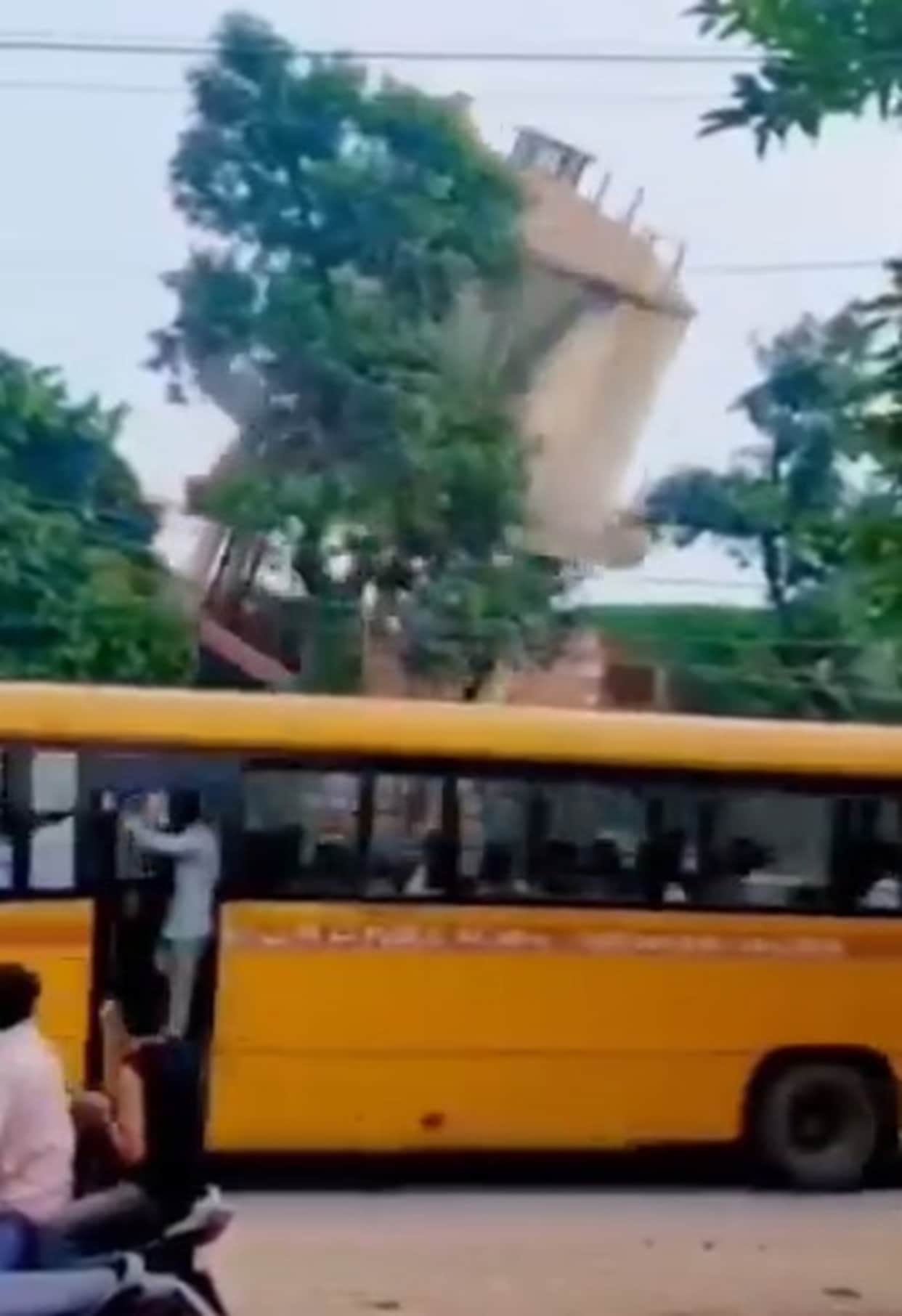 47-year-old water tank was being demolished; school bus had passed just seconds earlier.