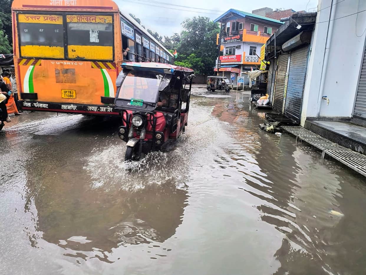 Waterlogging on roads due to rain adds to the difficulties.