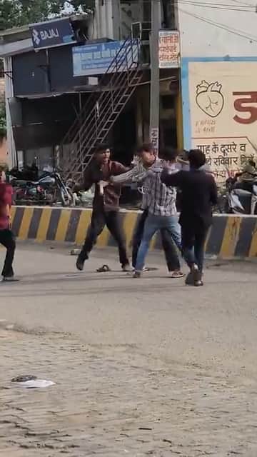 Lathis and sticks used just steps away from the police station; three injured.