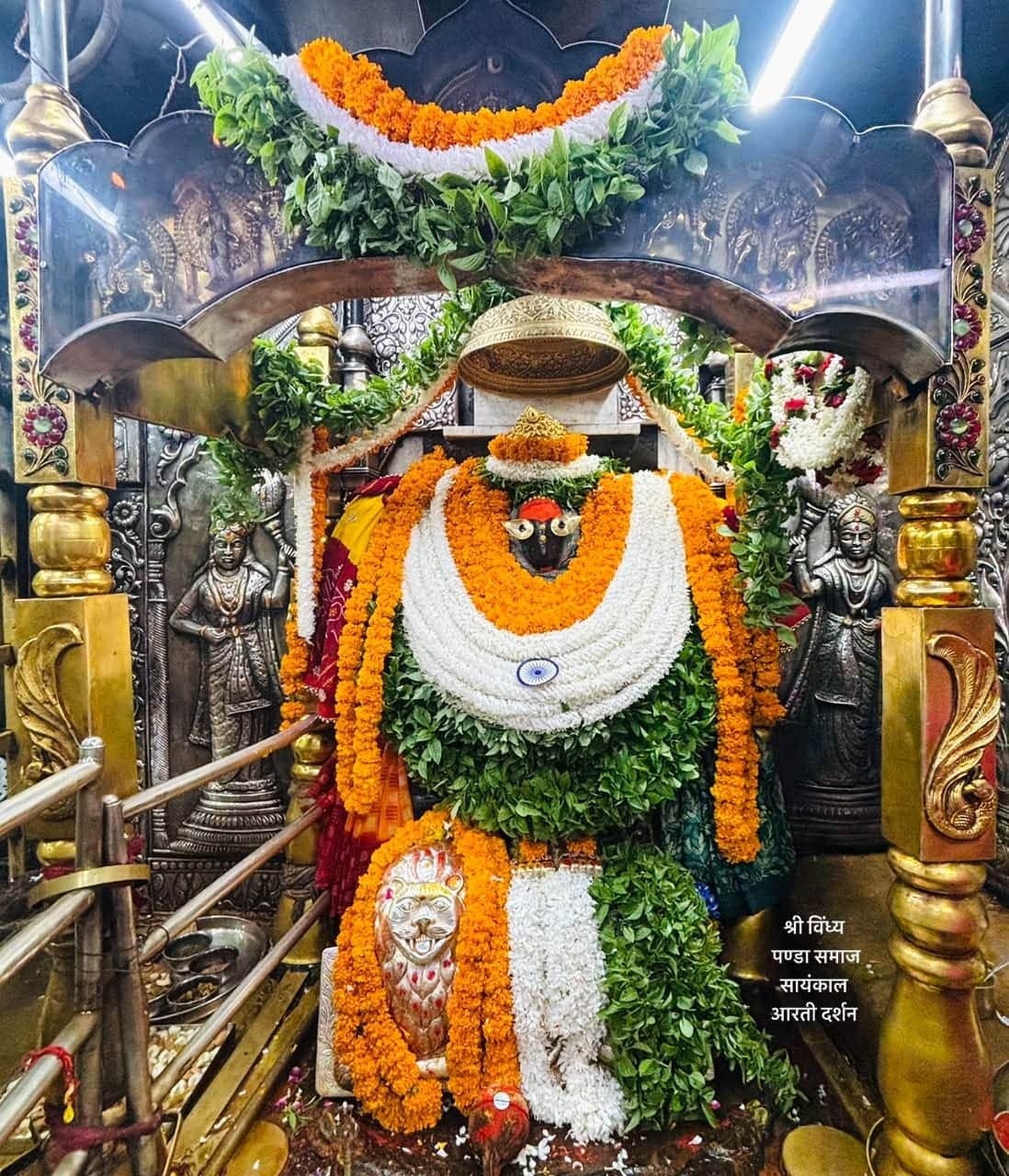 Maa Vindhyavasini adorned in the colours of the Tricolour; chants of 'Jai Kara' resound.