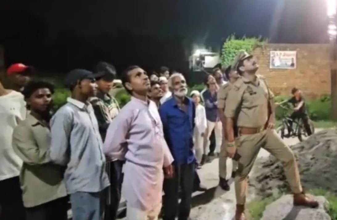 Two youths climbed a mobile tower to hoist the Tricolour; police brought them down safely.
