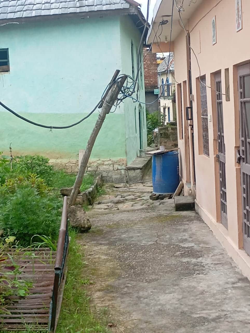 Electricity wires supported by bamboo in Chakrana village; heightened risk of accidents.