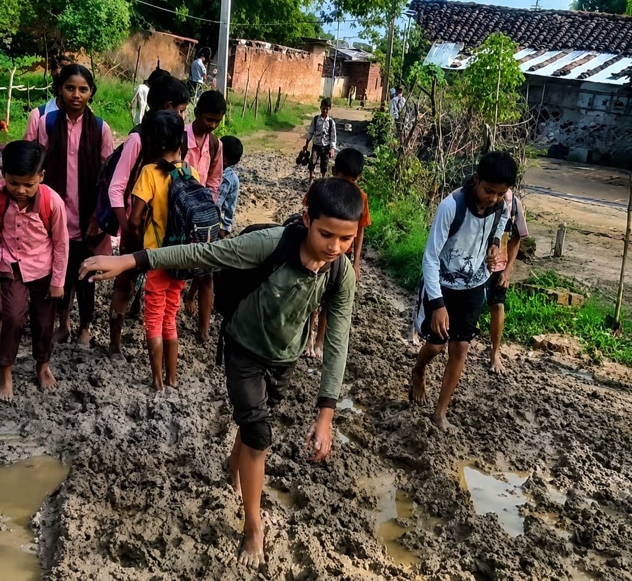 Children off to school... schoolbags on their backs, marshy mire beneath their feet.
