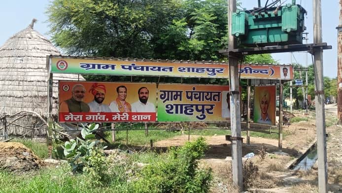 Signboards gleaming, bus shelters in shambles... Questions raised over development claims in Shahpur.