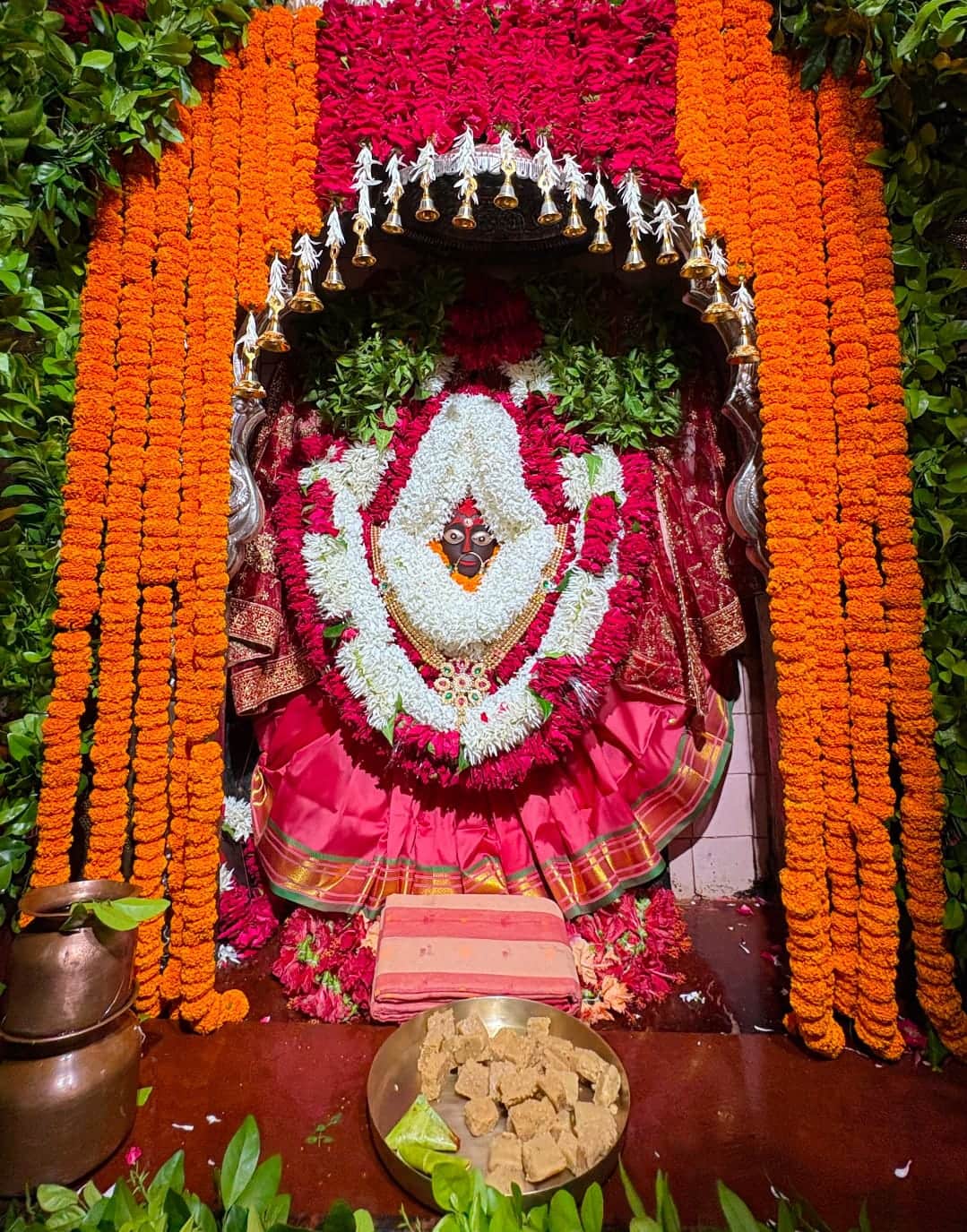Maa Sheetala adorned in a red saree.