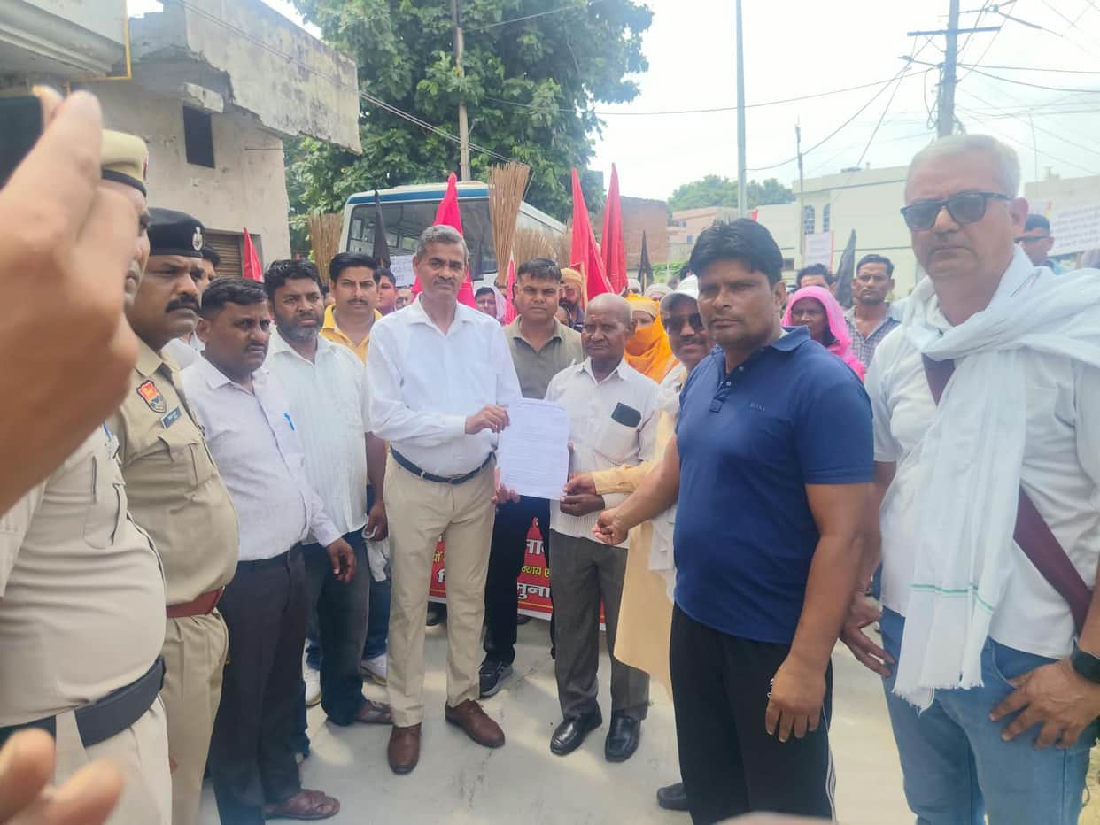 Sanitation and fire department staff protest at the Mayor's residence