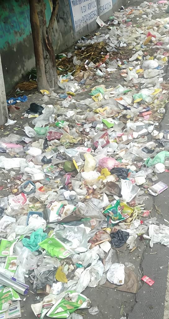 Garbage rotting on the streets due to the strike; piles of filth accumulating in the city's markets.