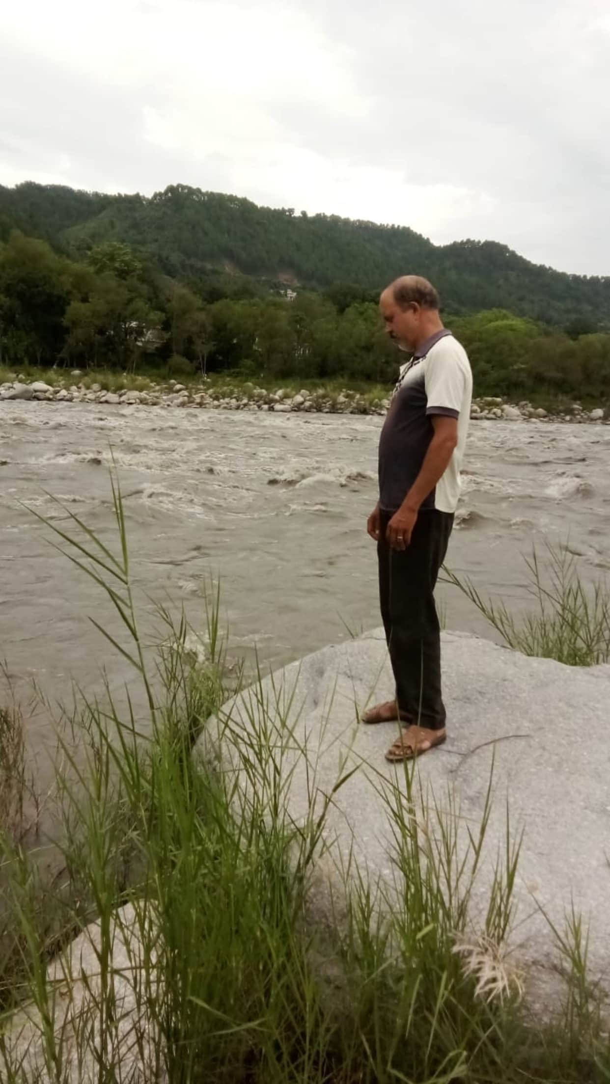 Grandfather scouring every nook and corner of the Ravi River to find his grandson.