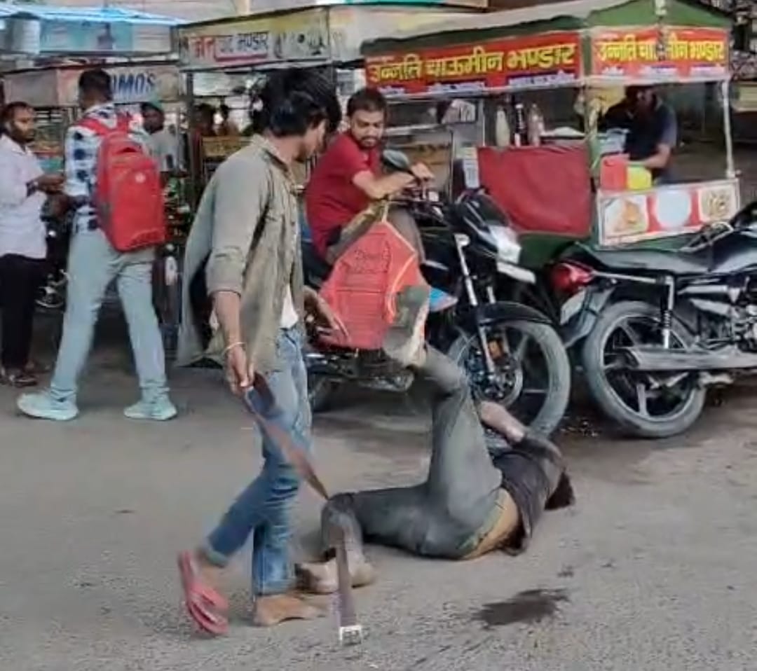 Youth beaten with a belt in front of police; video goes viral.