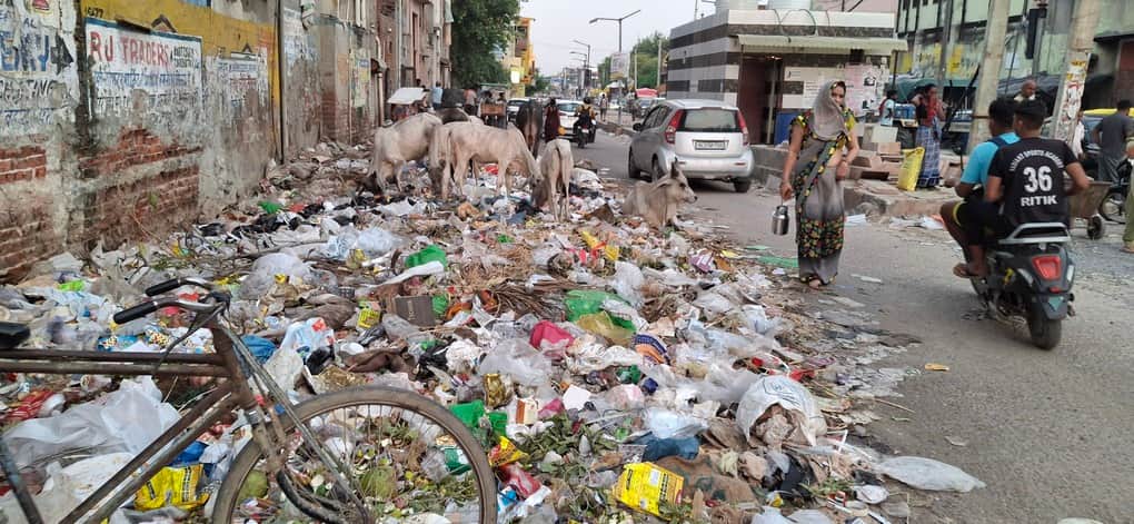 Garbage piles up in Bahadurgarh city due to sanitation workers' strike.