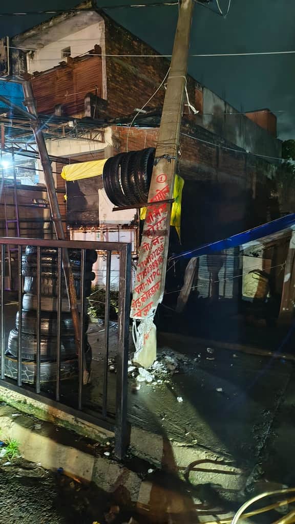 Wires entangled with dumper; three electricity poles toppled