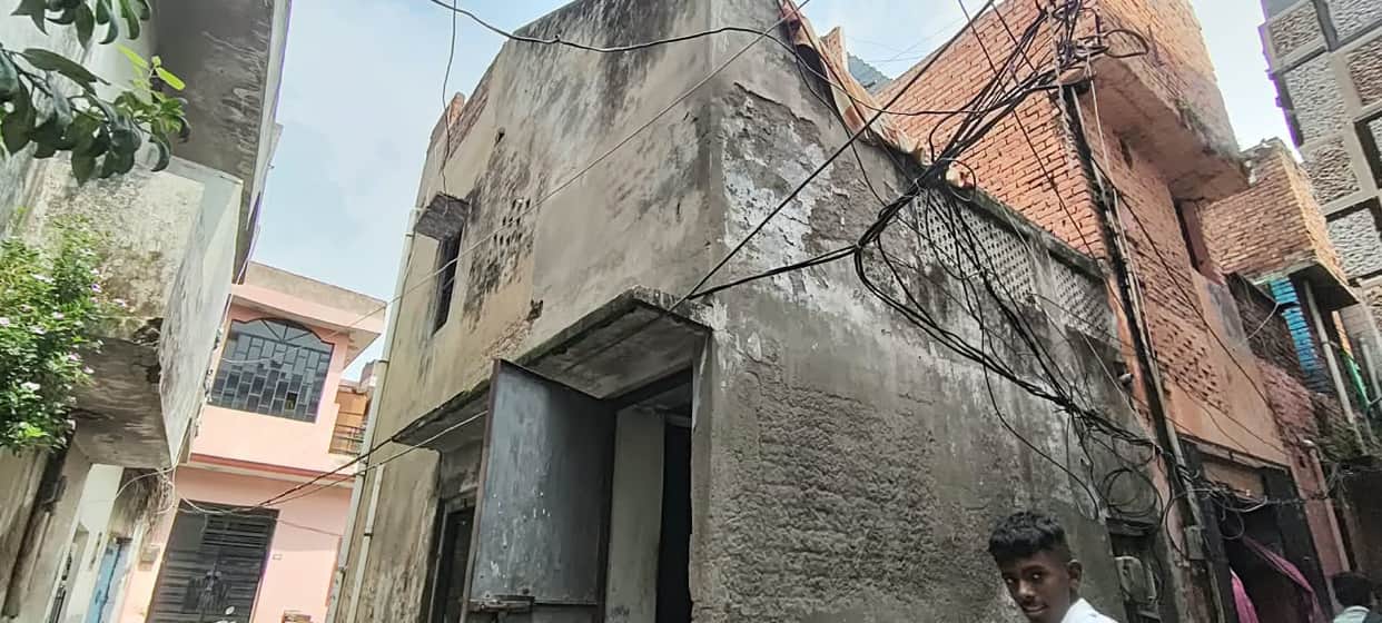 A bullet grazed the thigh of an elderly woman watching TV on the terrace.
