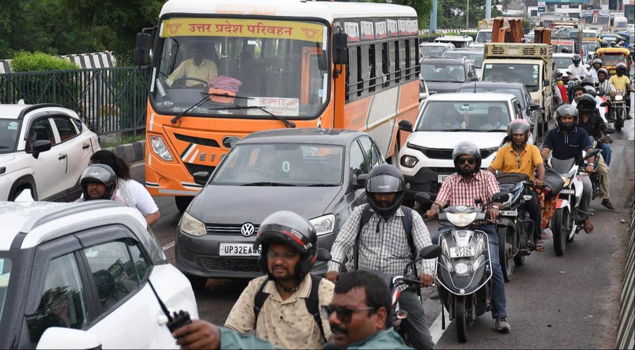 Traffic jam caused by autos and buses stopping on the road