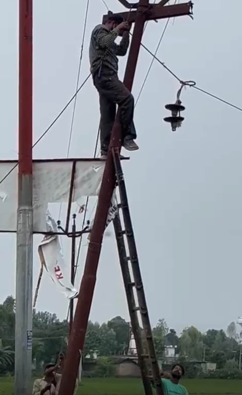 The wire was disconnected from the old pole and connected to the new electricity pole.