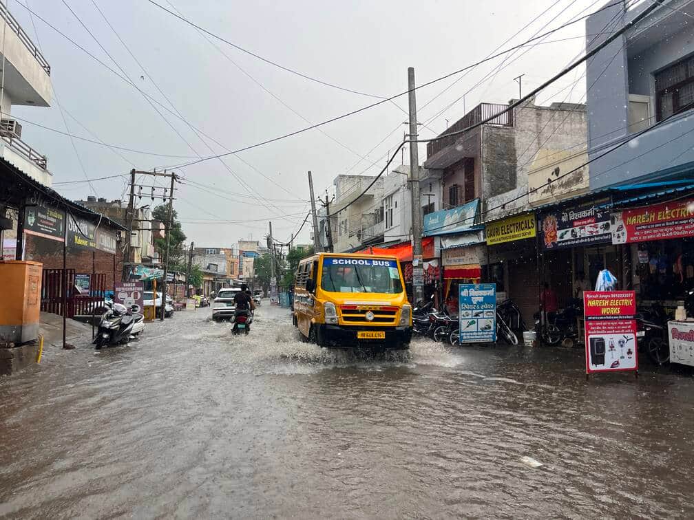 An hour of rain brought relief from the heat and left roads waterlogged.