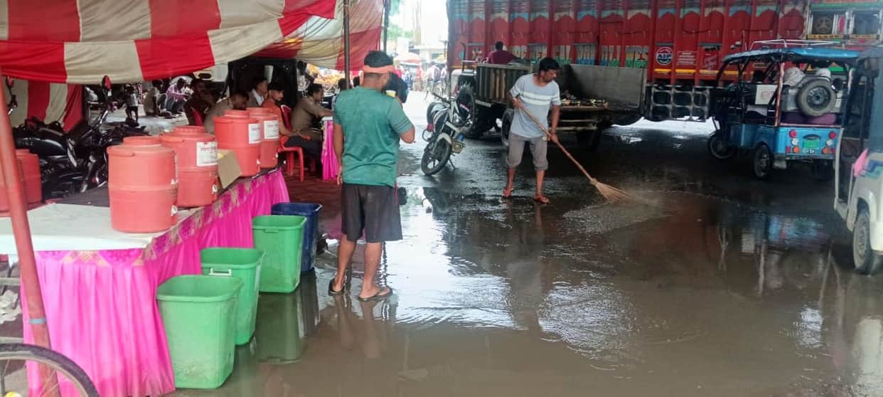 Waterlogging at Kanwariyas' rest camp due to light rain.