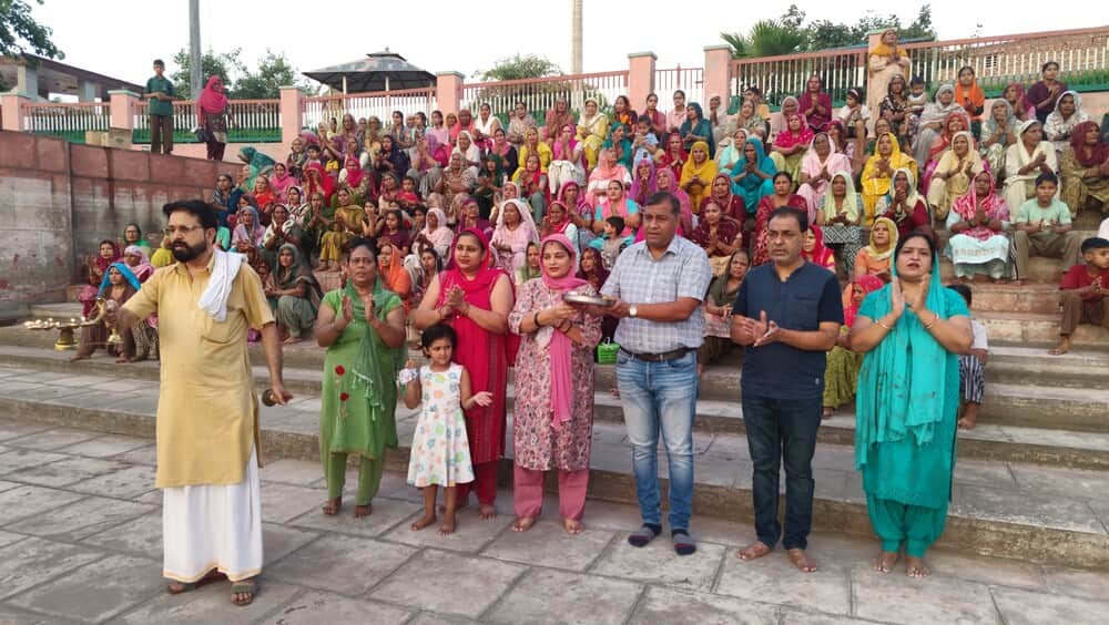 Crowd of devotees throng the evening aarti at the ancient Kapil Muni Tirtha.