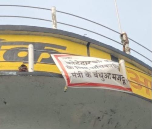 Upset over the restoration of a ration shop, a young man climbed a water tank.