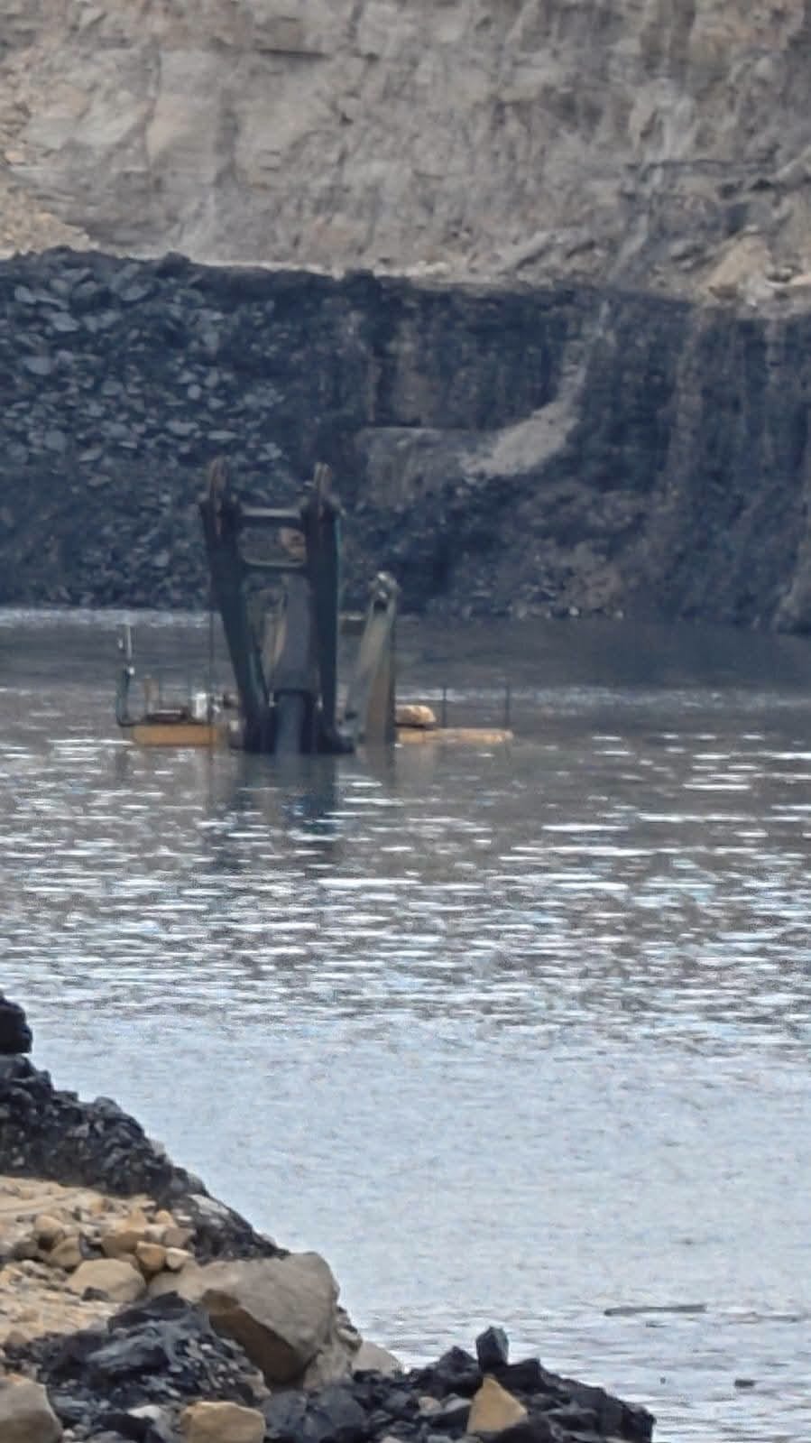Multi-crore shovel submerged at Nigahi coal mine.
