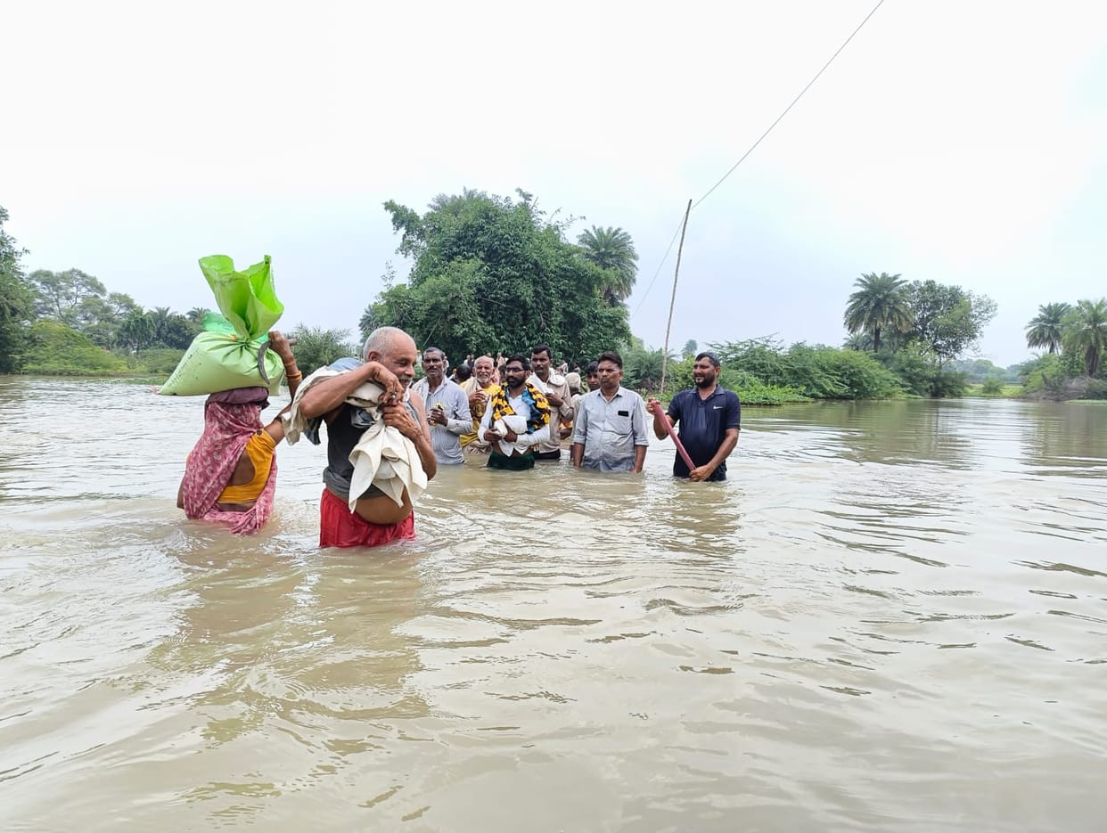 The vehicle of life submerged in waist-deep water...