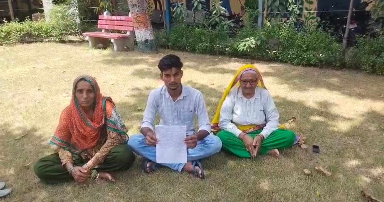 Family stages sit-in over stagnant, filthy water accumulating in front of their house for three months.