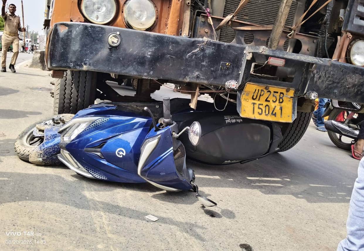 A young woman riding a scooter narrowly escaped being hit by a truck; the driver is in custody.