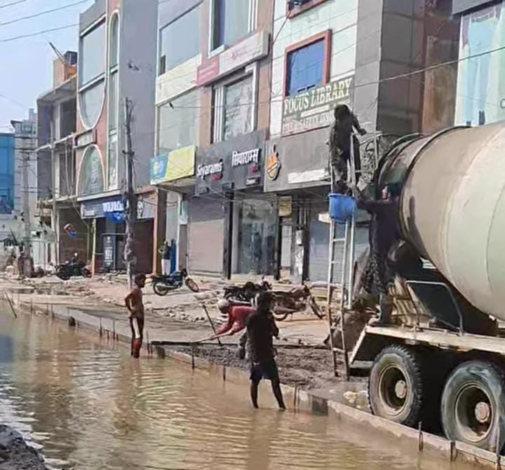 CC road construction amidst rain; department halts work.
